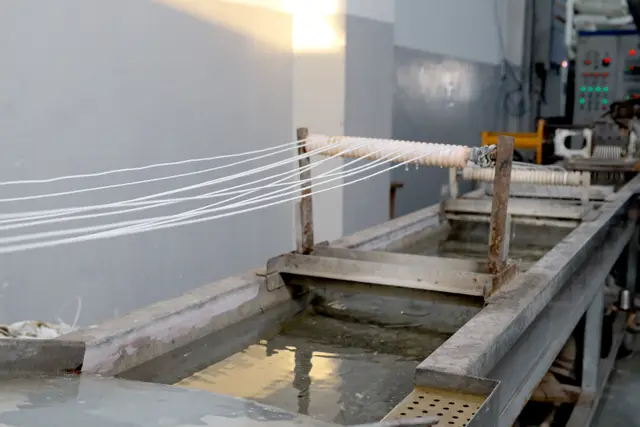 Strand cooling bath — Polymer strands cooled before pelletising